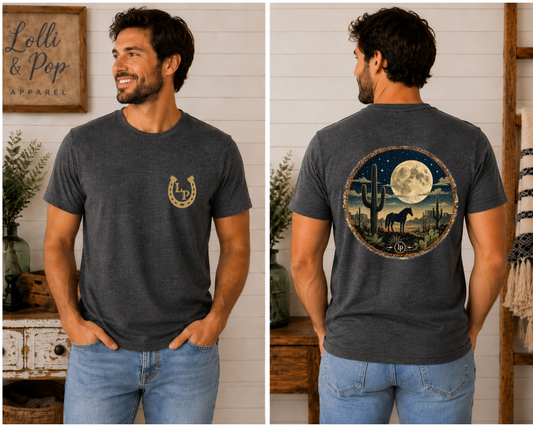 Man wearing the Horse Moon Desert graphic tee featuring a majestic horse beneath a glowing full moon in a desert landscape.